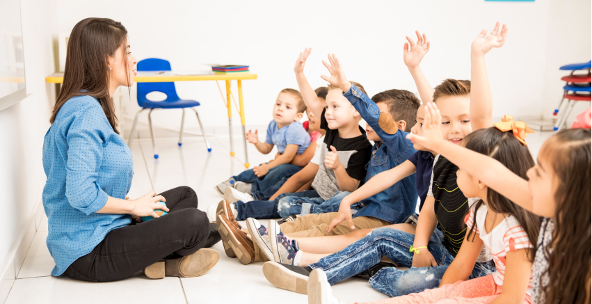 Preschool teacher with children