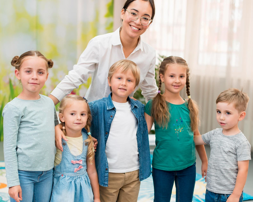 Preschool teacher with children